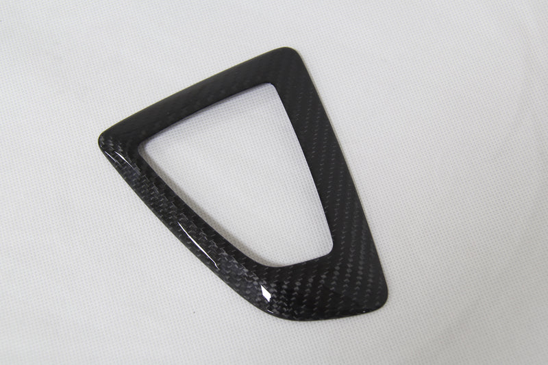 carbon fiber gear shifter cover on white background