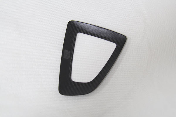 carbon fiber gear shifter cover on white background